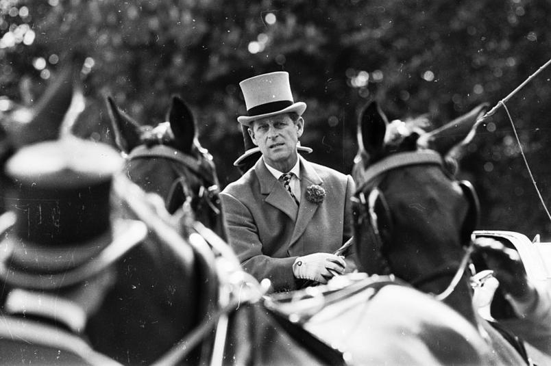 Prince Philip drives a chariot at a horse show at Windsor Castle