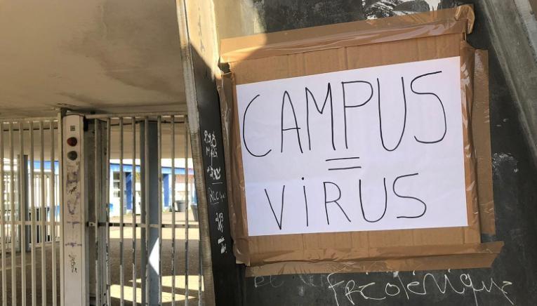 A poster at the Eugene Delacroix School written on it "Campus = viruses"