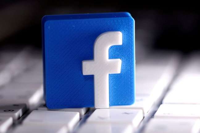 The 3D-printed Facebook logo appears on a keyboard in this illustration 03/25/2020 REUTERS / Dado Ruvic / Illustration