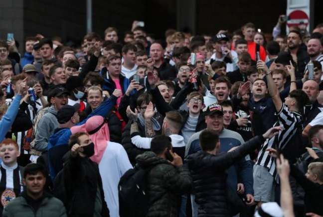 Newcastle fans celebrate the sale of the club to a Saudi investment fund (AFP)