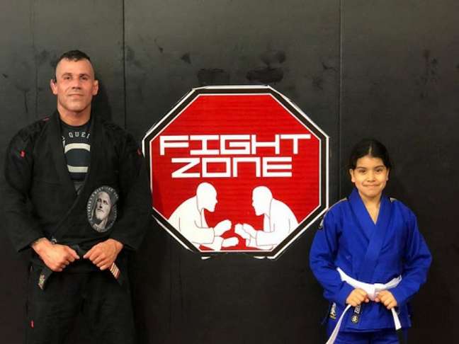 Leo Queiroz next to his daughter at a gym in England (Image: Personal Archive)