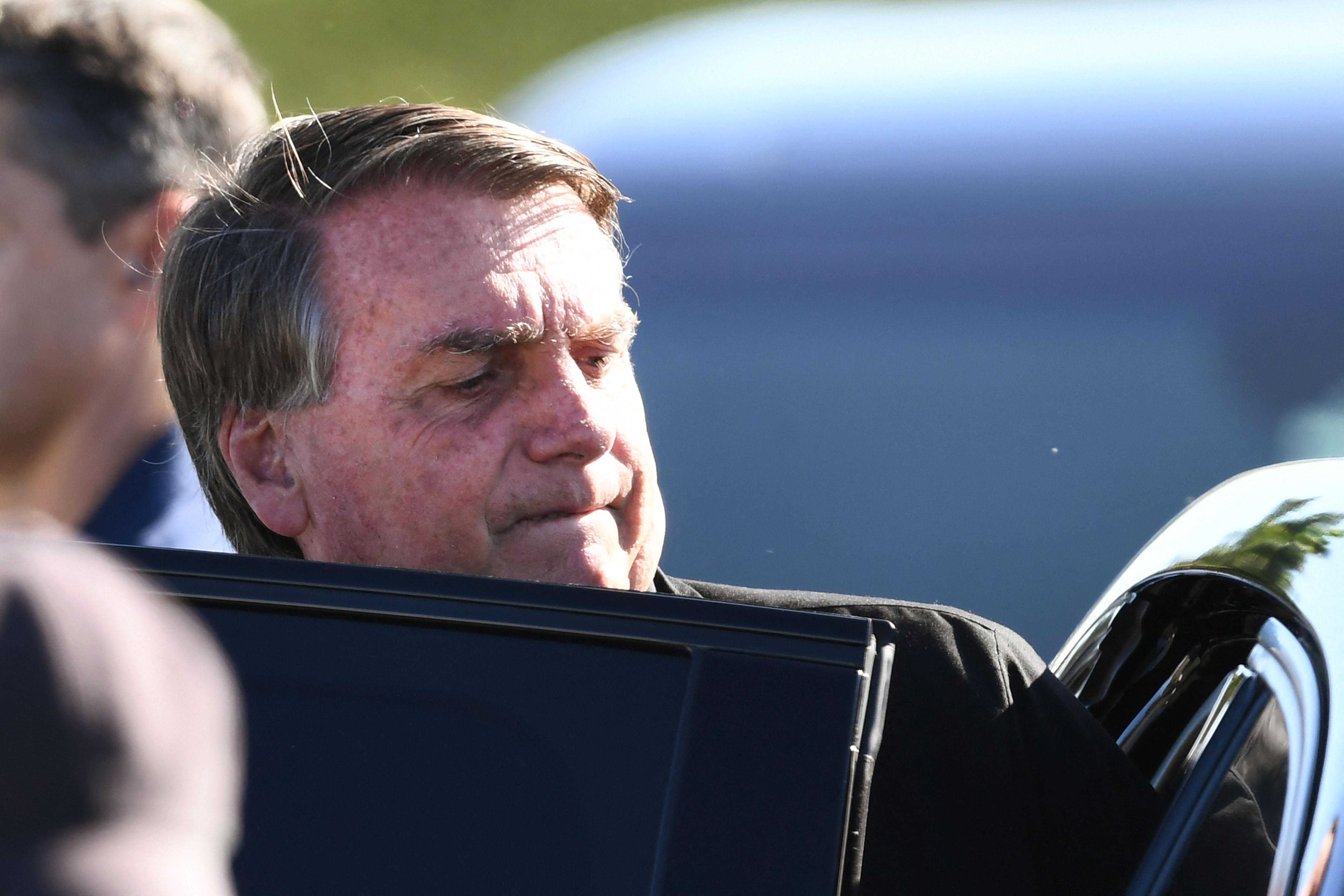 Brazilian President Jair Bolsonaro enters his car after a flag-raising ceremony in honor of Diplomat's Day at Alvorada Palace in Brasilia, April 20, 2022 (Photo by EVARISTO SA / AFP)