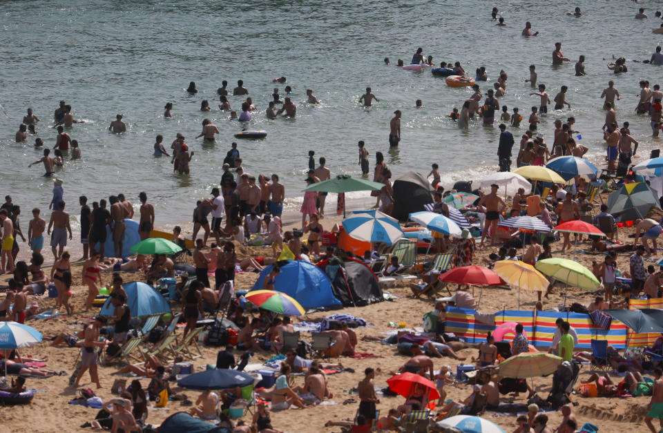 Adults and children enjoy the warm weather as a heatwave hits Bournemouth beaches (Image: REUTERS/Hannah McKay)